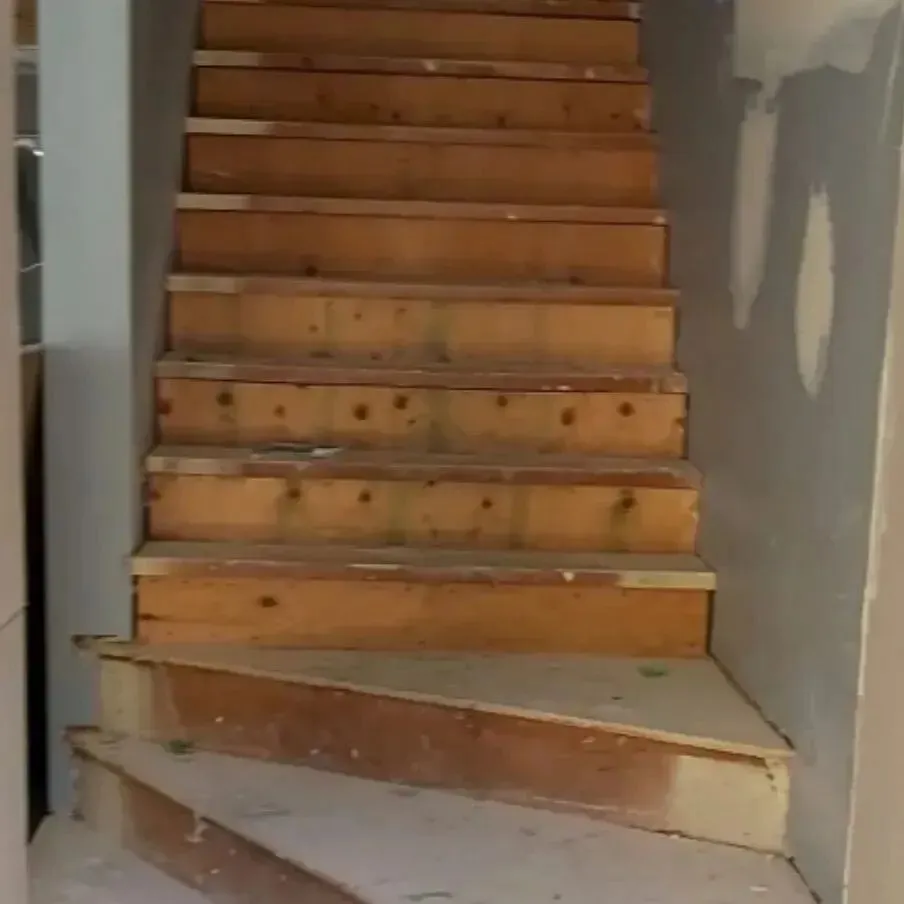 The brief: turn a builder-grade stair into a finish-carpentry feature