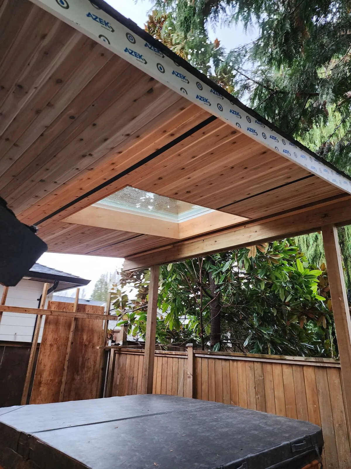 Cedar T&G ceiling with a skylight over the tub