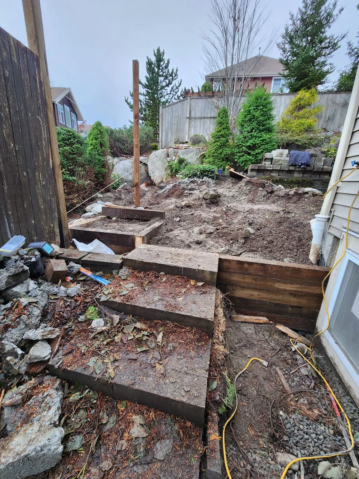 Tiered timber retaining walls and base prep