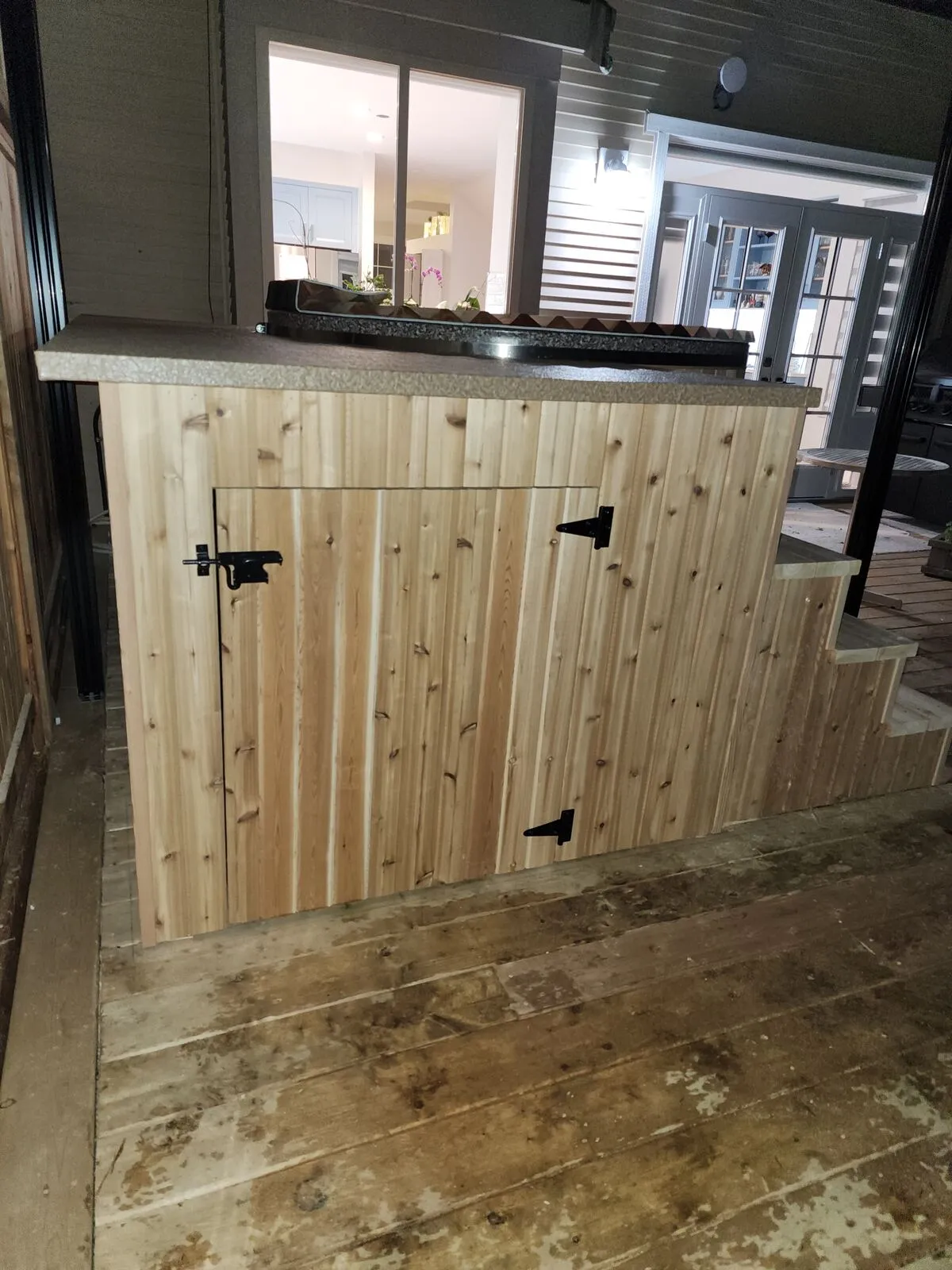 Finish carpentry: cedar cabinet, stone tops and concealed hardware