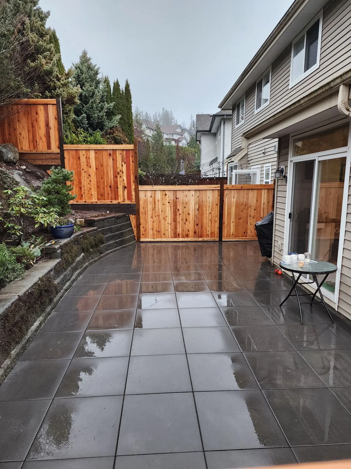 Charcoal-grey paving stone patio