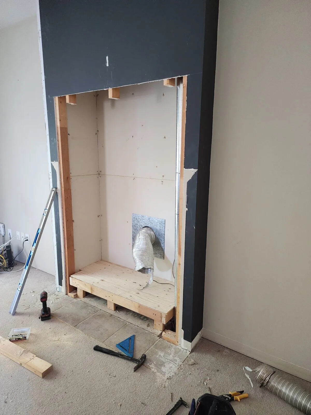 Rebuilding the fireplace: linear gas, whitewashed plank tile, 45° mitred corners