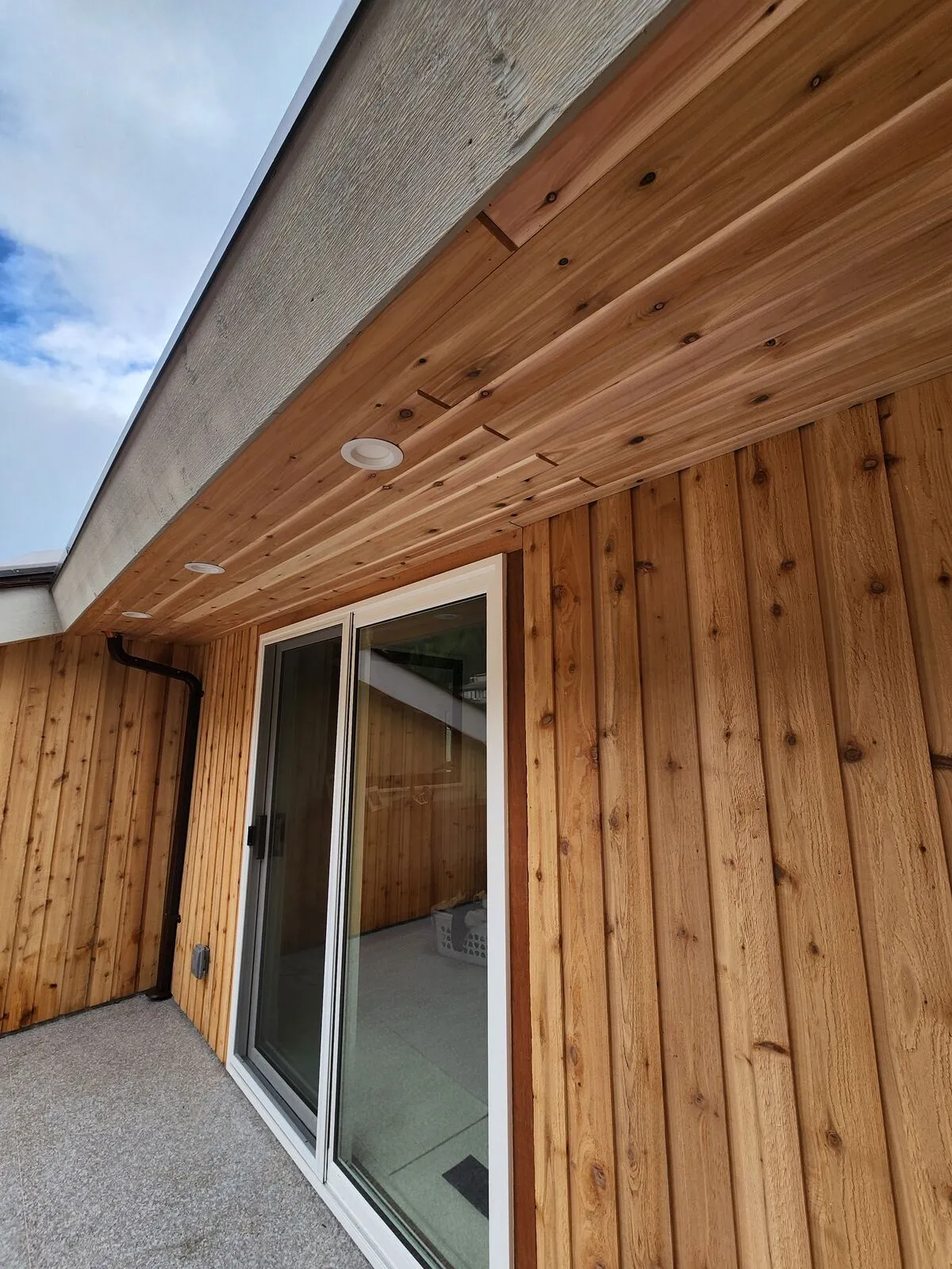 Cedar soffit with continuous vent strip
