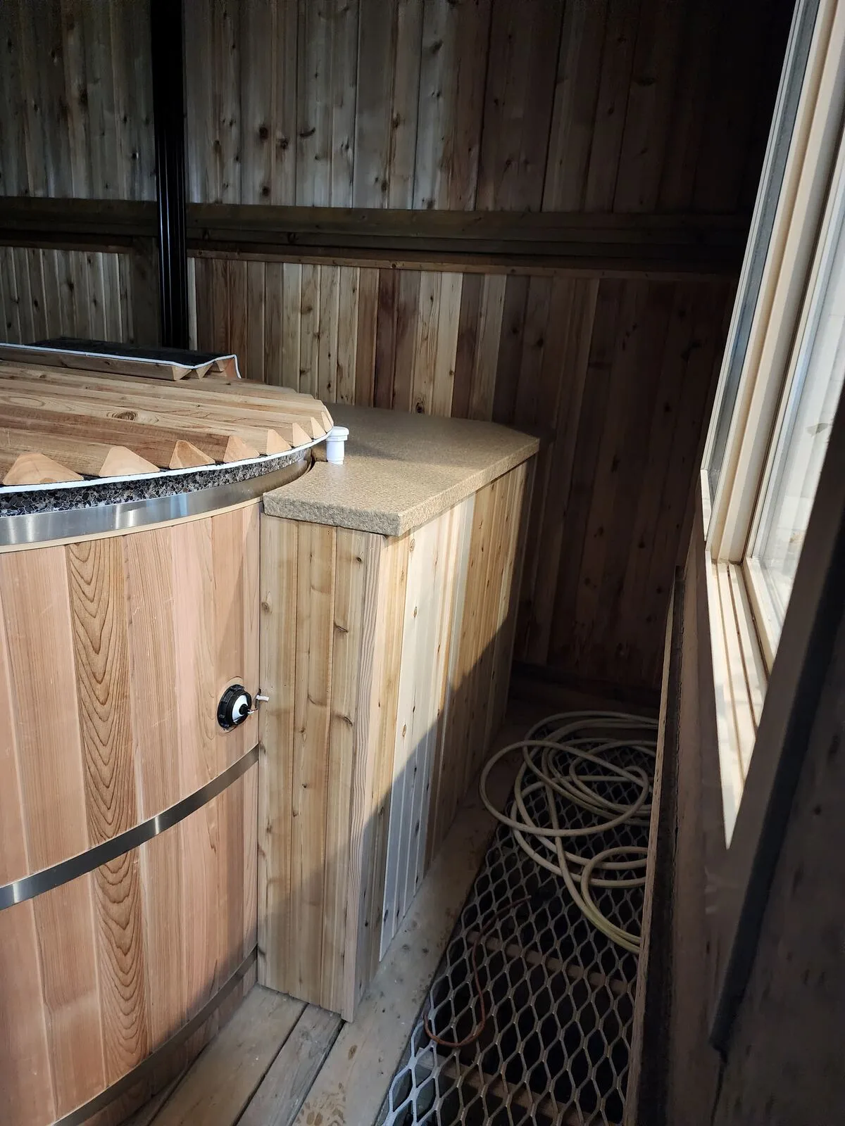 Finish carpentry: cedar cabinet, stone tops and concealed hardware