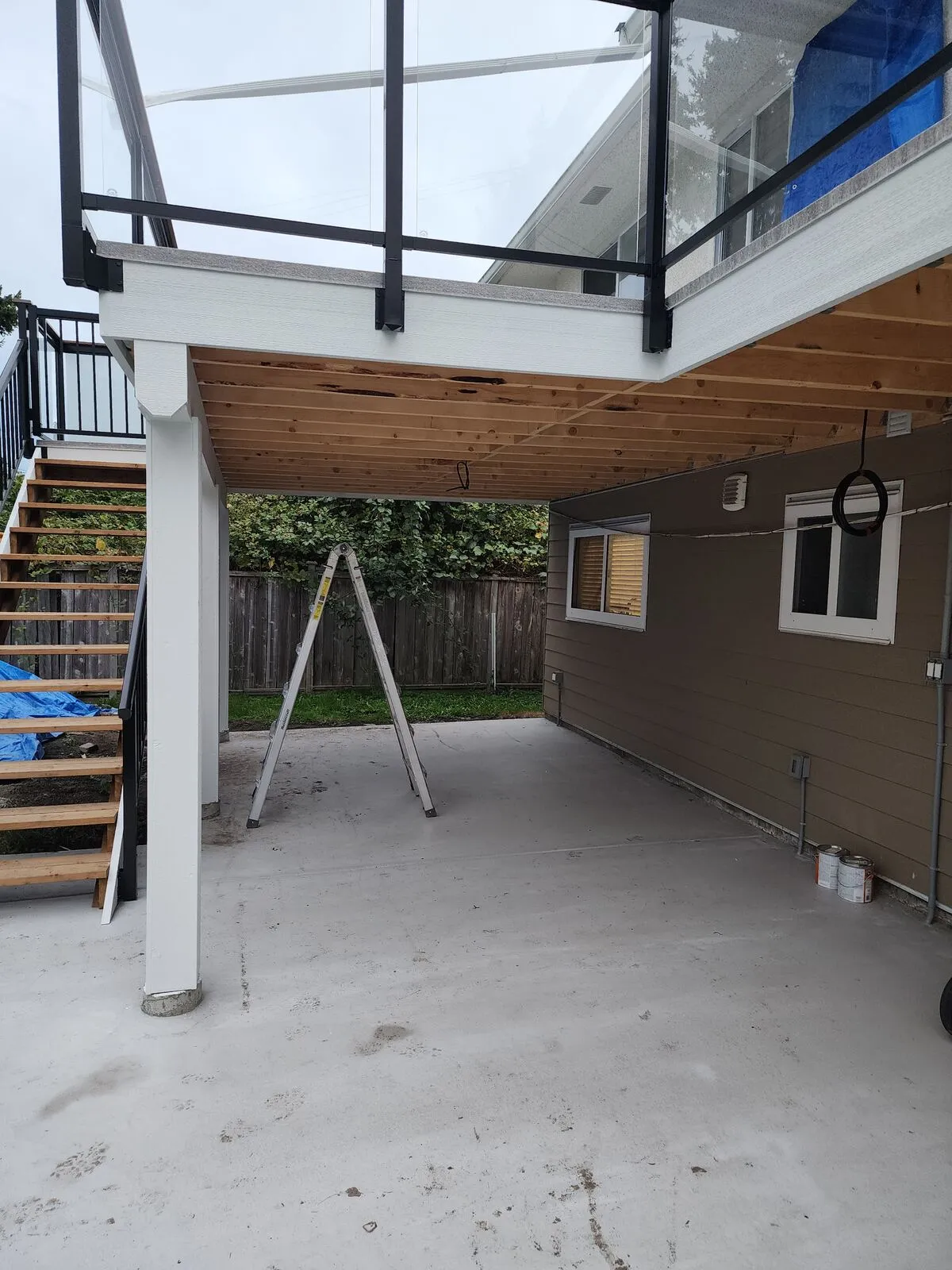 Open-riser stair down to grade