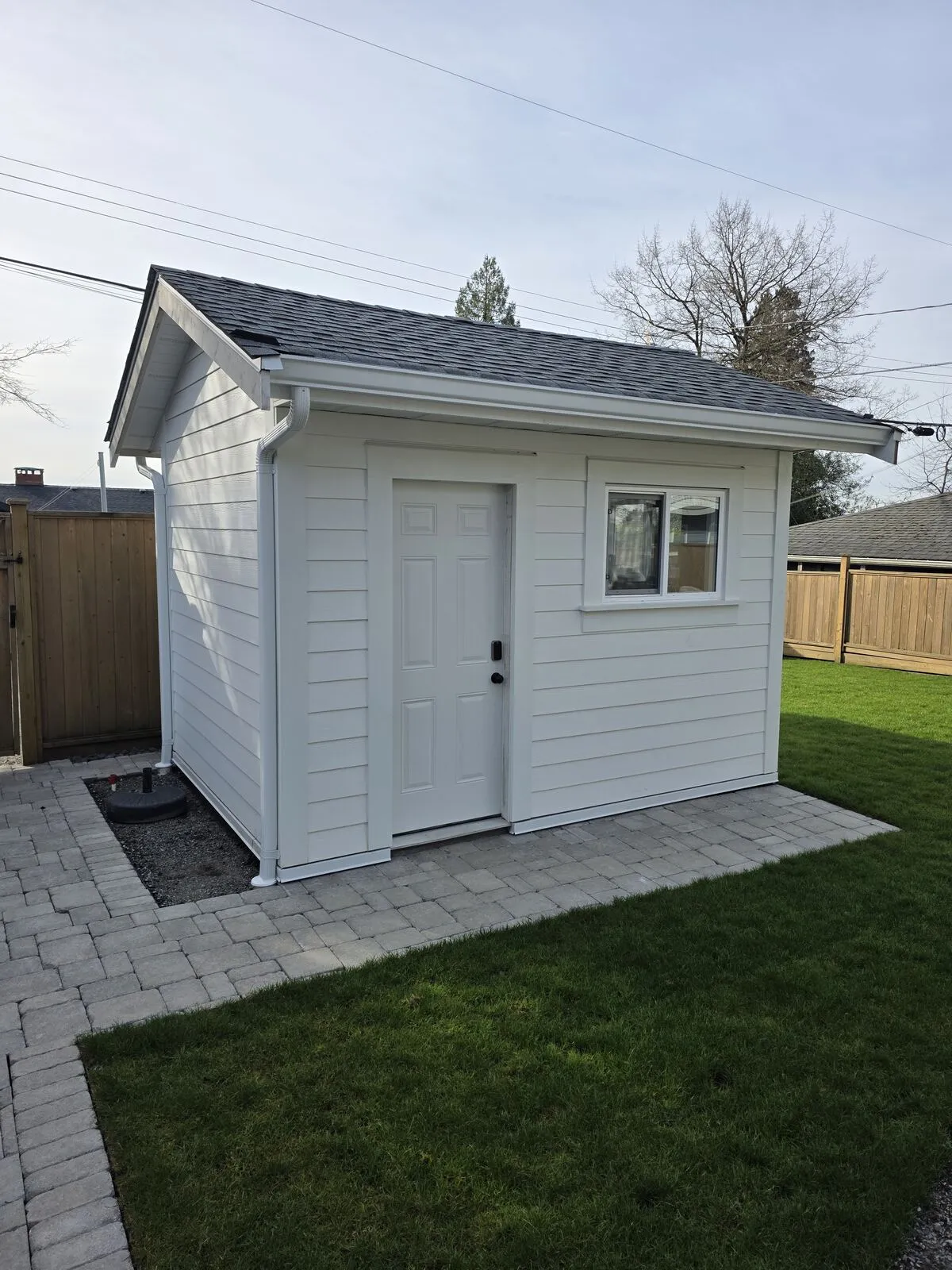 Hardie cladding, shingled roof, finished exterior