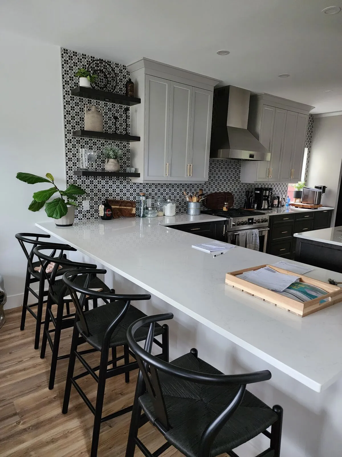 The new kitchen: warm-grey Shaker, quartz peninsula, mosaic backsplash