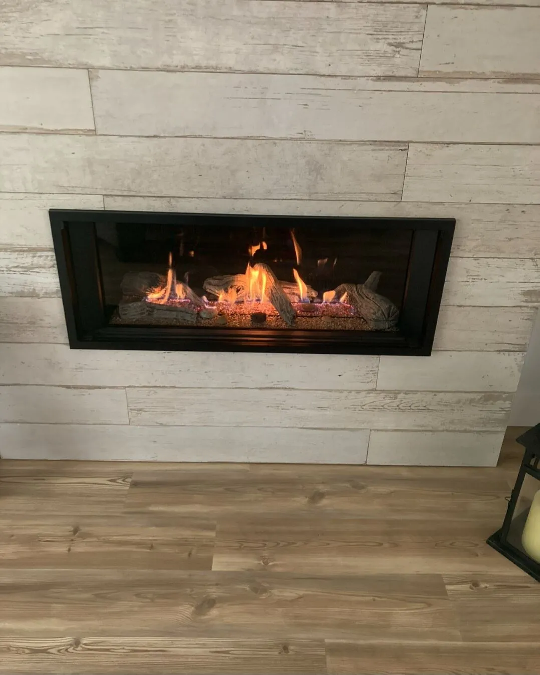 Rebuilding the fireplace: linear gas, whitewashed plank tile, 45° mitred corners