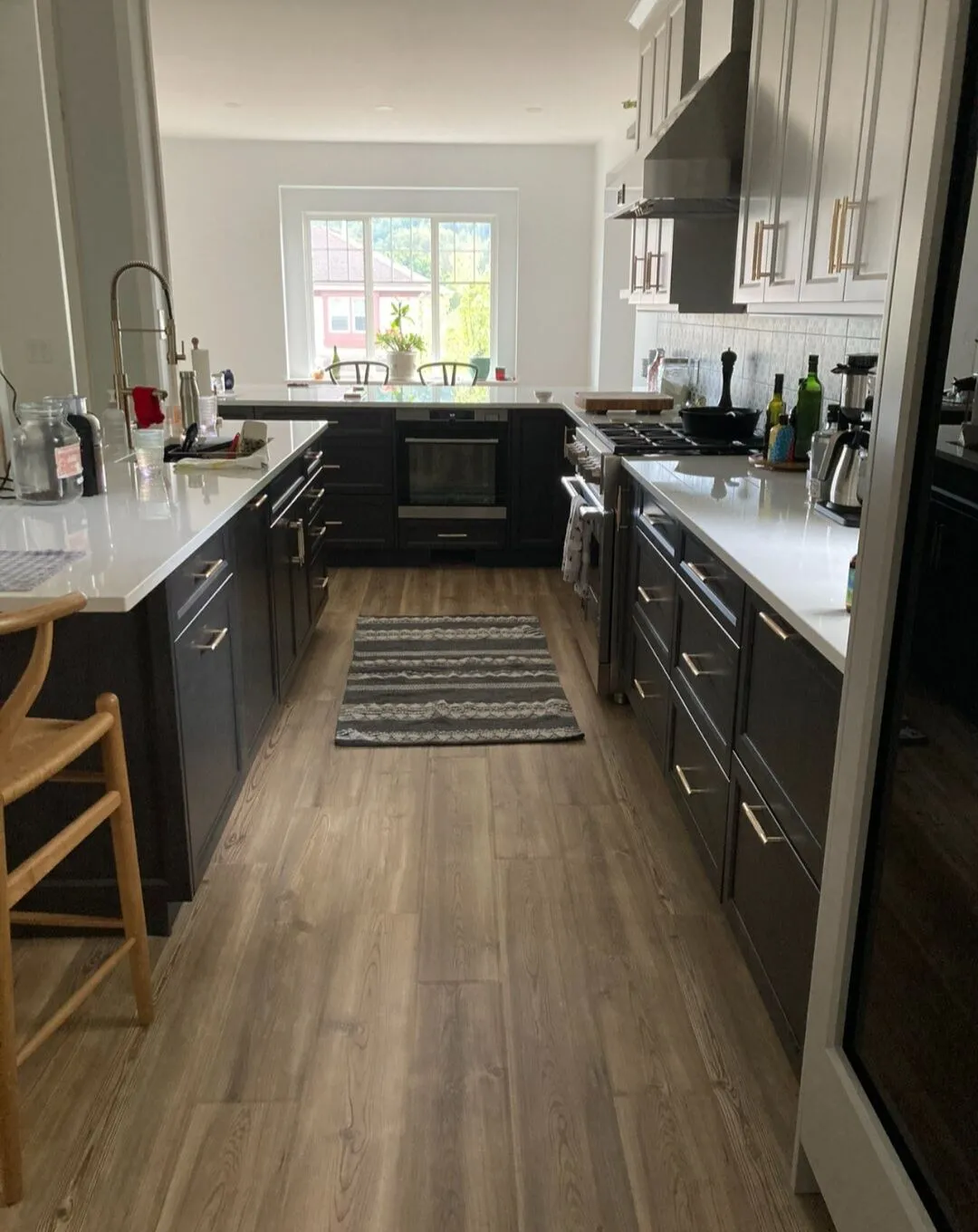 The new kitchen: warm-grey Shaker, quartz peninsula, mosaic backsplash