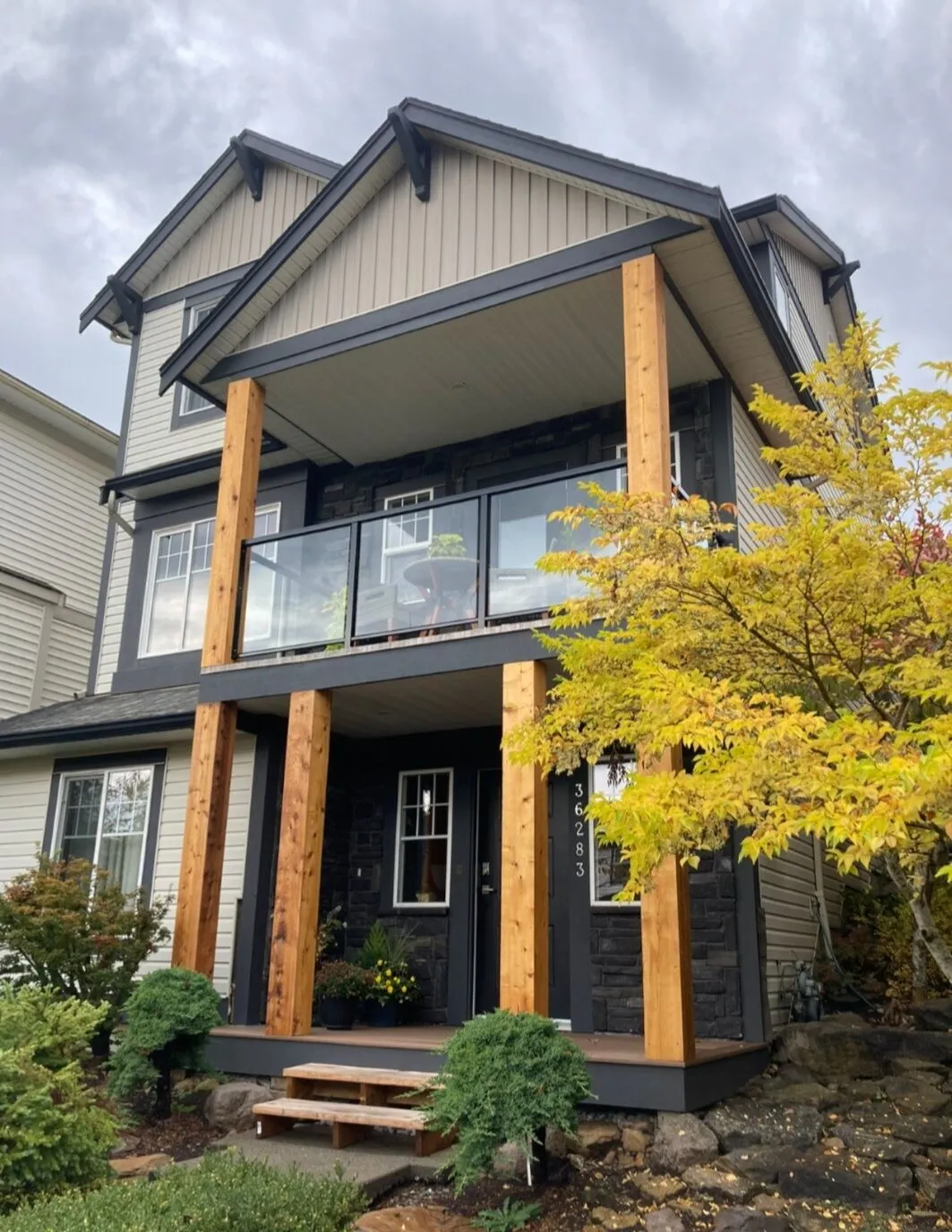 Outside: pony walls out, cedar-wrapped posts, vinyl deck and composite landing